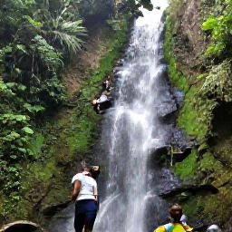 Caribbean Holidays, Cheap Jamaica Holidays, Dunn's River Falls in Jamaica with visitors climbing the clear cascades surrounded by lush green forest