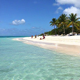 Caribbean Holidays, Cheap January Bahamas, Quiet Cable Beach with clear shallow water, palm trees and a couple relaxing on the sand