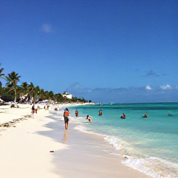 Caribbean Holidays, Cheap January Holidays, Punta Cana beach in January with clear water, white sand, palm trees and travellers enjoying water sports