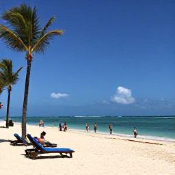 Caribbean Holidays, Cheap July Holidays, Travellers enjoying a spacious sandy beach near Punta Cana, Dominican Republic, with sun loungers, palm trees and calm blue sea