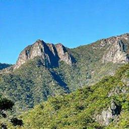Caribbean Holidays, Cuba Adventure Holidays, A rugged Cuban mountain landscape with lush green forest, limestone peaks and a clear blue sky