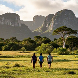 Caribbean Holidays, Cuba Adventure Holidays, Hikers walking through the green landscapes and limestone mountains of Vi&ntilde;ales, Cuba, in warm April sunshine