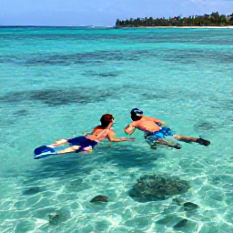 Caribbean Holidays, Cuba Beach Holidays, Couple snorkelling in clear shallow Caribbean water near a Cuban beach, with colourful fish and coral visible below