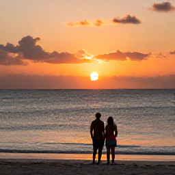 Caribbean Holidays, Cuba Couples Holidays, Couple watching a vivid sunset over the Caribbean Sea from a quiet Cuban beach