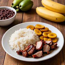 Caribbean Holidays, Cuba Culture Holidays, Traditional Cuban meal with rice and beans, roast pork, plantain and fresh tropical ingredients on a rustic table