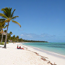 Caribbean Holidays, Cuba January Tours, Calm Caribbean beach in Cuba in January with white sand, turquoise water, palm trees and a couple relaxing by the shore