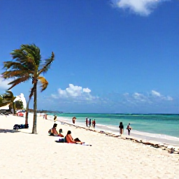 Caribbean Holidays, Cuba Tours April, White sandy beach in Varadero with turquoise Caribbean water, palm trees and travellers relaxing in April sunshine