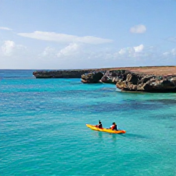 Caribbean Holidays, Cura&ccedil;ao Adventure Holidays, Kayakers exploring the turquoise waters and rocky coastline of Cura&ccedil;ao on a bright November morning
