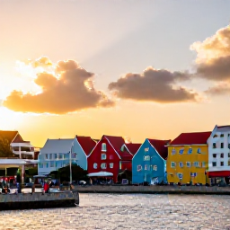 Caribbean Holidays, Cura&ccedil;ao Adventure, Willemstad waterfront in Cura&ccedil;ao at sunset, showing colourful Dutch colonial buildings, a harbour and people exploring the streets