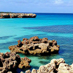 Caribbean Holidays, Cura&ccedil;ao Beach Holidays, Snorkellers exploring a colourful coral reef off Cura&ccedil;ao, with tropical fish, rocky coastline and clear shallow water
