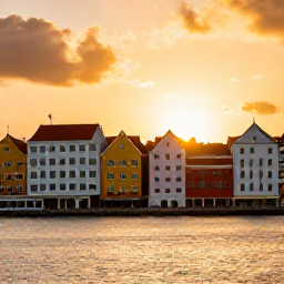 Caribbean Holidays, Curacao Birdwatching, Relaxed December evening in Willemstad, Cura&ccedil;ao, with colourful waterfront buildings and a warm Caribbean sunset