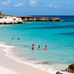 Caribbean Holidays, Cura&ccedil;ao Business Class, Travellers swimming and snorkelling in a sheltered turquoise bay on Cura&ccedil;ao, with white sand, rocky coastline and clear sunshine