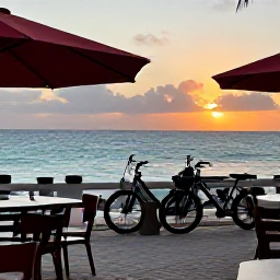 Caribbean Holidays, Cura&ccedil;ao Cycling Holidays, Relaxed seaside restaurant terrace in Cura&ccedil;ao at sunset with bicycles nearby and the Caribbean Sea in the background