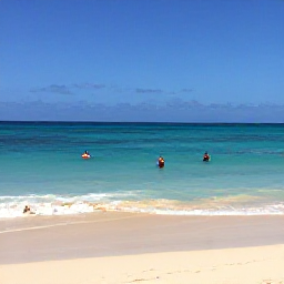 Caribbean Holidays, Cura&ccedil;ao February Holidays, Clear turquoise sea and a quiet sandy cove in Cura&ccedil;ao, with snorkellers enjoying calm February waters