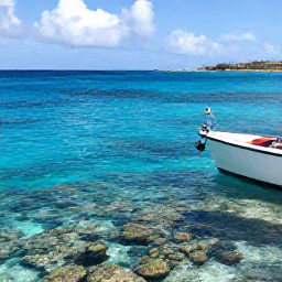 Caribbean Holidays, Curacao Fishing, Anglers fishing beside a coral reef in transparent blue water, with Cura&ccedil;ao coastline visible in the distance