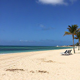 Caribbean Holidays, Cura&ccedil;ao in April, Wide sandy Caribbean beach in Cura&ccedil;ao during bright April sunshine, calm turquoise water, sun loungers and a few palm trees