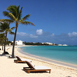 Caribbean Holidays, Cura&ccedil;ao in February, Quiet Cura&ccedil;ao beach with sun loungers, clear blue water and palm trees under a bright February sky