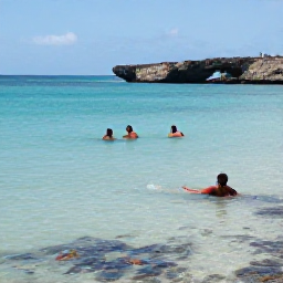 Caribbean Holidays, Cura&ccedil;ao in February, Travellers swimming and snorkelling in calm clear water at Playa Kenepa on Cura&ccedil;ao, with colourful fish and a rugged coastline