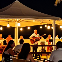 Caribbean Holidays, Cura&ccedil;ao in October, Relaxed Cura&ccedil;ao evening with outdoor dining, lanterns, live local music and visitors enjoying a warm Caribbean night