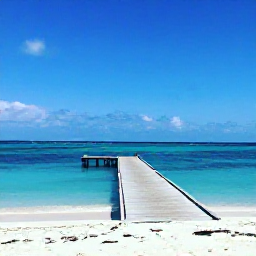 Caribbean Holidays, Cura&ccedil;ao Instagram Hotspots, Turquoise Caribbean sea, white sand and a wooden jetty at Playa Kenepa, Cura&ccedil;ao, under a clear blue sky