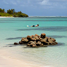 Caribbean Holidays, Curacao Nature Holidays, A calm Cura&ccedil;ao bay with a snorkeller above clear water, coral reef, tropical fish and a quiet sandy beach