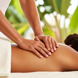 Caribbean Holidays, Cura&ccedil;ao Wellness January, Person receiving a relaxing massage at a stylish Cura&ccedil;ao spa, natural materials, soft light and tropical greenery