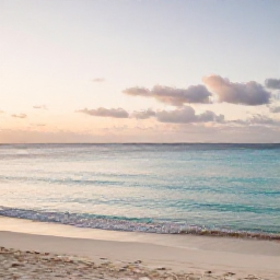 Caribbean Holidays, Cura&ccedil;ao Wellness, Quiet tropical beach in Cura&ccedil;ao at sunrise, calm turquoise water, soft sand and a relaxed holiday atmosphere