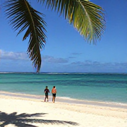 Caribbean Holidays, December Adults Only, A quiet tropical beach in Tobago in December, with clear turquoise water, soft sand, shady palms and two adults walking beside the sea