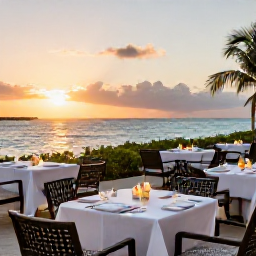 Caribbean Holidays, December Adults Only, Elegant adults-only Caribbean resort dining terrace in Turks and Caicos at sunset in December, tables overlooking the sea