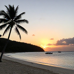 Caribbean Holidays, December Beaches, Quiet palm-fringed beach at sunset in Bequia, Saint Vincent and the Grenadines, with small boats anchored in calm water