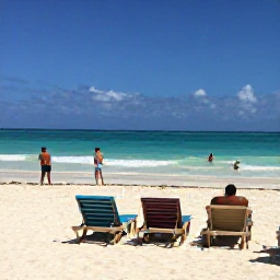 Caribbean Holidays, December Cuba Holidays, White sandy Cuban beach with sun loungers, turquoise water and travellers enjoying a warm December day
