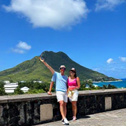 Caribbean Holidays, December Honeymoons, Couple exploring historic Brimstone Hill Fortress on Saint Kitts with green hills, blue sky and Caribbean sea in the background
