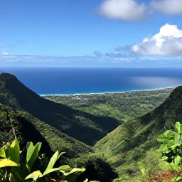 Caribbean Holidays, December Hotspots, A lush Caribbean viewpoint overlooking green mountains, rainforest and a sparkling blue sea in December sunshine