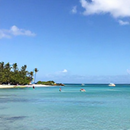 Caribbean Holidays, December Instagram Hotspots, A peaceful turquoise lagoon at Grand Cul-de-Sac in Saint Barth&eacute;lemy, with paddleboarders, palm trees and a bright blue sky
