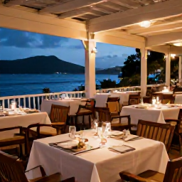 Caribbean Holidays, December Martinique, Elegant Martinique restaurant serving Creole and French-inspired food on a relaxed terrace in the evening