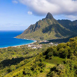 Caribbean Holidays, Dominica Holidays, A lush aerial view of Dominica's volcanic mountains, rainforest and blue Caribbean coastline