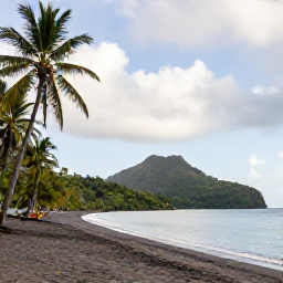 Caribbean Holidays, Dominica Holidays, A quiet black-sand beach on Dominica with palm trees, calm sea and green hills