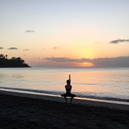 Caribbean Holidays, Dominica Wellness, A quiet Caribbean beach in Dominica at sunrise, with calm water, dark volcanic sand and a person practising gentle yoga