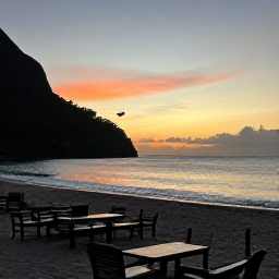 Caribbean Holidays, Dominica Wellness, Peaceful sunset over Dominica&rsquo;s Caribbean coastline, comfortable outdoor seating and a tranquil island evening