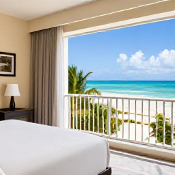 Caribbean Holidays, Dominican Luxury January, Elegant luxury hotel suite with balcony overlooking a tropical Dominican Republic beach in January