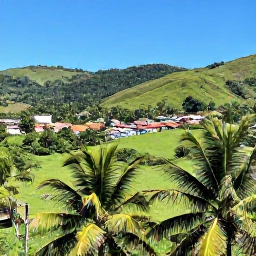 Caribbean Holidays, Dominican November, Scenic Dominican Republic countryside with palm trees, green hills and a small traditional village beneath clear November skies
