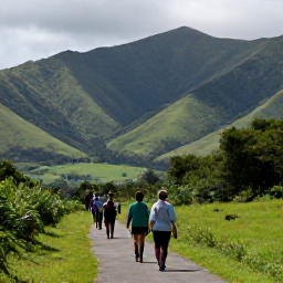Caribbean Holidays, Dominican Republic Walking, A scenic mountain footpath overlooking green valleys and distant peaks in the Dominican Republic, with walkers enjoying the view