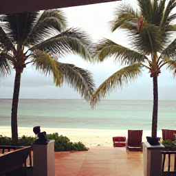 Caribbean Holidays, Dominican September, A comfortable Dominican Republic resort terrace overlooking a tropical beach after a brief rain shower, with fresh green palms, warm light and calm sea