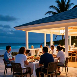 Caribbean Holidays, February Adults Only, Outdoor beachfront restaurant serving fresh seafood at dusk on Providenciales, Turks and Caicos, with adults enjoying a relaxed February evening