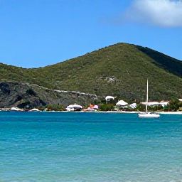 Caribbean Holidays, February Adventures, A sunny coastal view of Saint Martin and Sint Maarten in February, with turquoise water, green hills and a small sailing boat