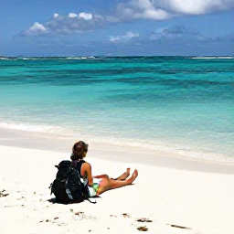 Caribbean Holidays, February Backpacking, Backpacker relaxing on a quiet white-sand beach beside clear turquoise water on a Bahamian island