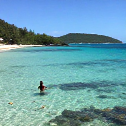 Caribbean Holidays, February Beaches, A tranquil Caribbean cove with clear shallow water, snorkellers, colourful fish and green hills in the background