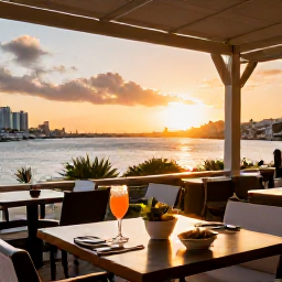 Caribbean Holidays, February Breaks, Outdoor terrace restaurant in Charlotte Amalie at sunset, Caribbean dishes, cocktails and views over the harbour
