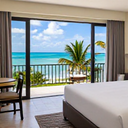 Caribbean Holidays, February Couples Holidays, A stylish Caribbean hotel suite with an open balcony overlooking turquoise water, soft natural light and tropical greenery