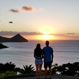 Caribbean Holidays, February Couples Holidays, Romantic Caribbean sunset over Saint Martin coastline with a couple watching from a viewpoint